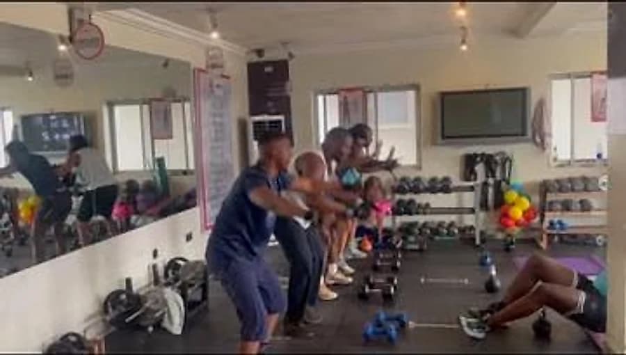 A morning group session working through squats and core